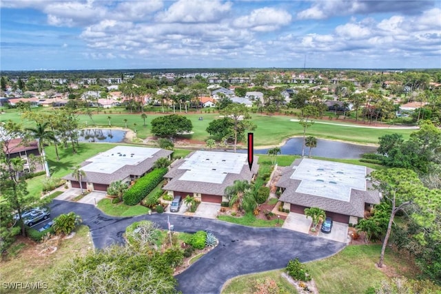 birds eye view of property with a water view and a residential view