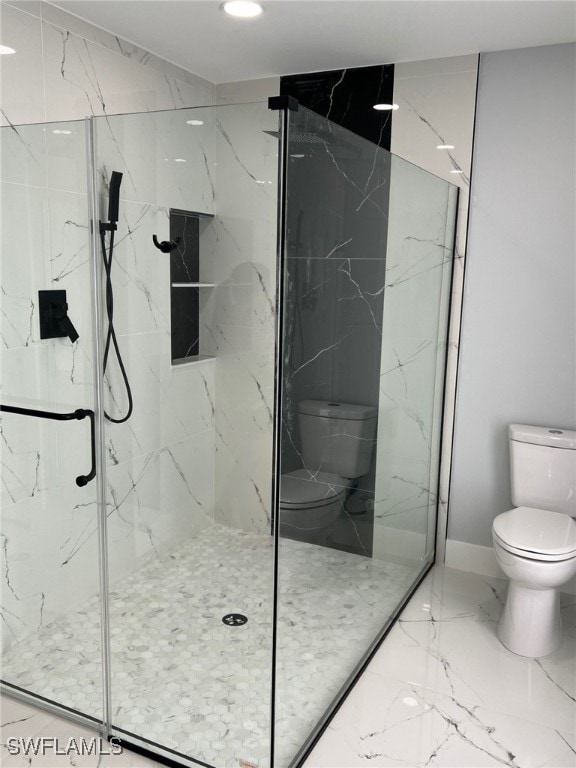 full bath featuring marble finish floor, a marble finish shower, toilet, and baseboards