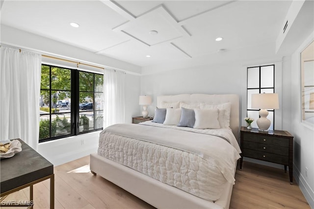 bedroom with recessed lighting and light wood-style floors