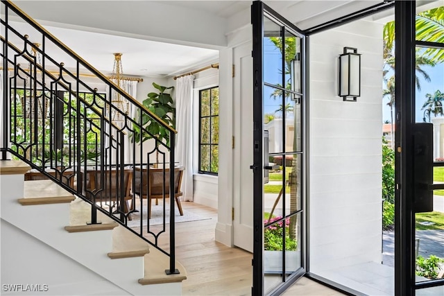 entryway featuring stairway and wood finished floors