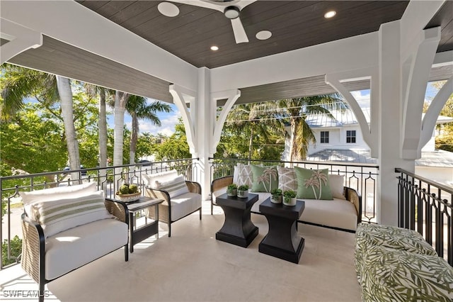 view of patio / terrace with a ceiling fan, an outdoor living space, and a balcony