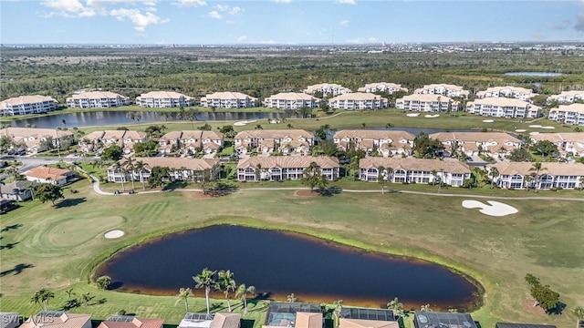 aerial view with view of golf course, a water view, and a residential view