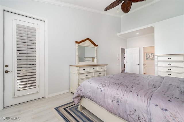 bedroom featuring light wood finished floors, ensuite bathroom, ornamental molding, ceiling fan, and baseboards