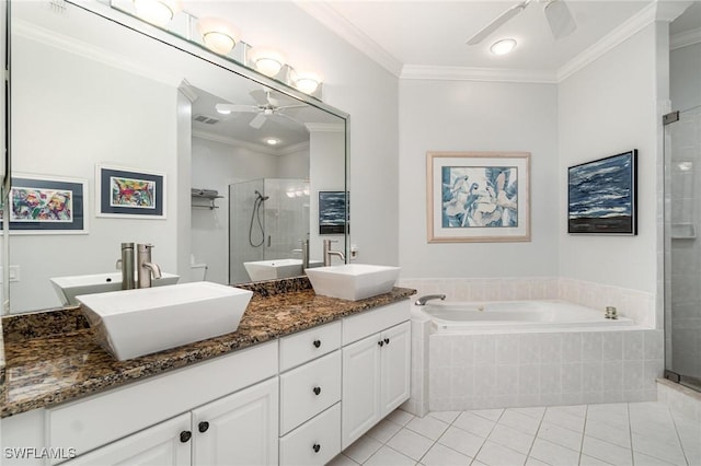 full bathroom with ornamental molding, a sink, a shower stall, and ceiling fan