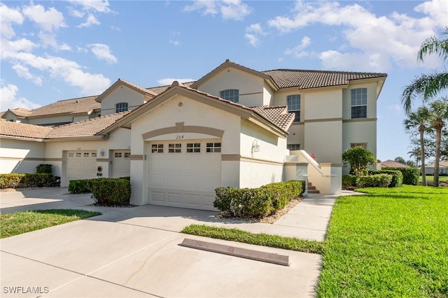 view of front facade with driveway, stucco siding, a tile roof, an attached garage, and a front yard