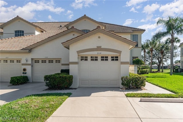 view of front of house with a tile roof, stucco siding, concrete driveway, an attached garage, and a front lawn