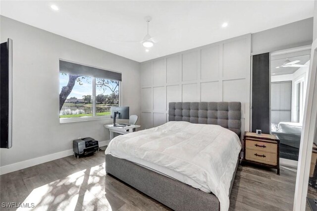 bedroom featuring wood finished floors, baseboards, recessed lighting, and a ceiling fan