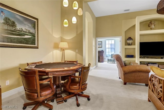 interior space featuring carpet, visible vents, built in features, and baseboards