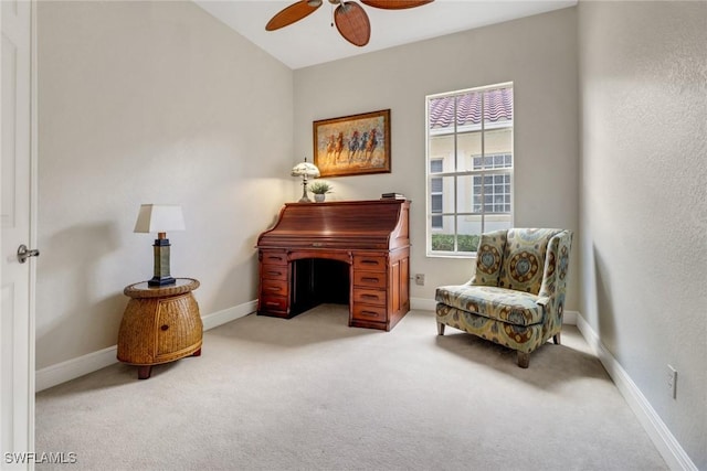 sitting room featuring ceiling fan, baseboards, and carpet flooring