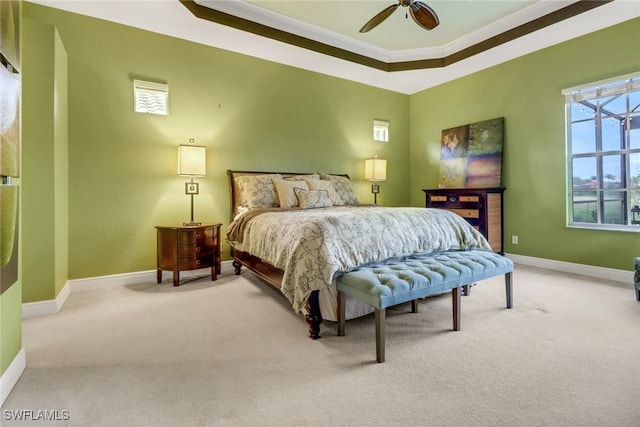 bedroom featuring ceiling fan, baseboards, ornamental molding, and light colored carpet