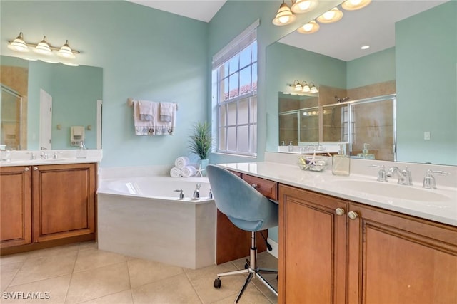 full bath featuring a stall shower, a sink, and tile patterned floors