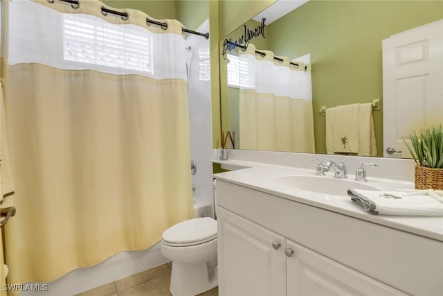 bathroom featuring toilet, tile patterned flooring, shower / bath combo with shower curtain, and vanity