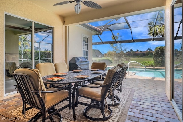 sunroom with a ceiling fan