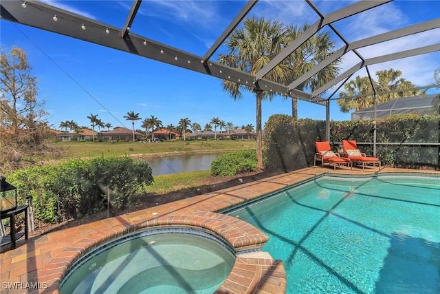 pool with a water view, a lanai, and an in ground hot tub