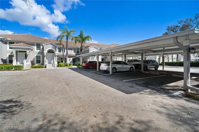 covered parking lot with a residential view