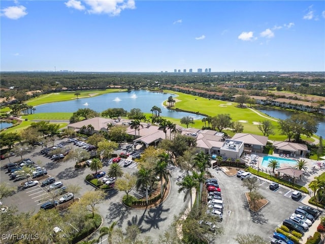 birds eye view of property featuring a water view and golf course view