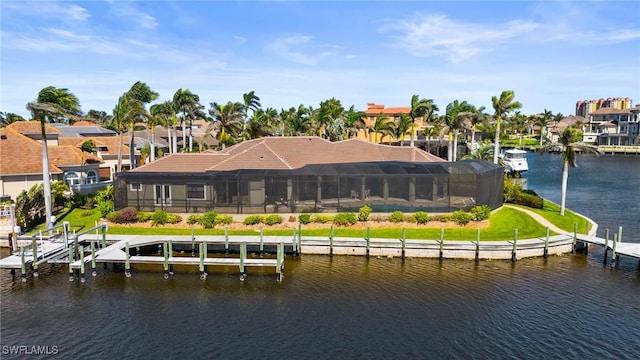 dock area with a residential view, a water view, boat lift, and a lanai