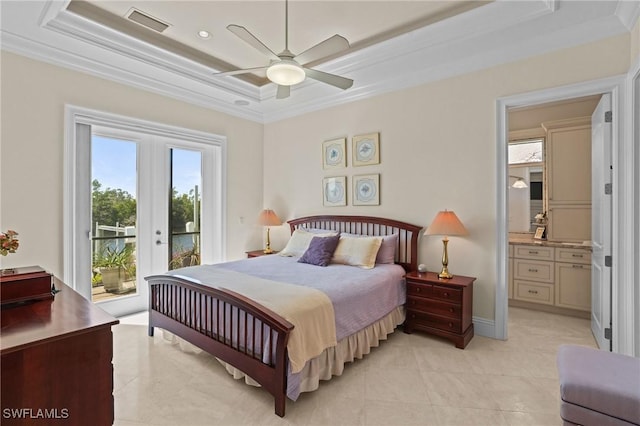 bedroom with a tray ceiling, multiple windows, access to exterior, and crown molding