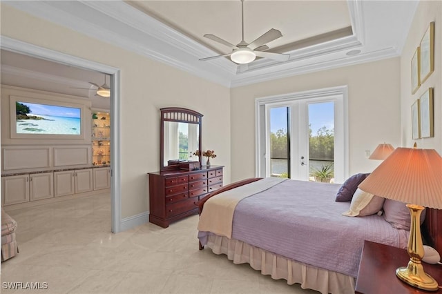 bedroom with access to exterior, multiple windows, a tray ceiling, and ornamental molding