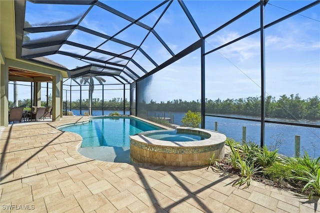 view of swimming pool with a patio, a lanai, a water view, and a pool with connected hot tub