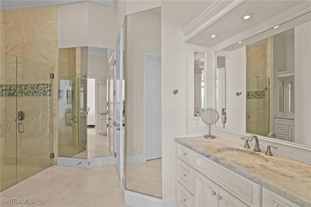 bathroom with tile patterned floors, a stall shower, and vanity