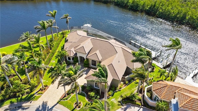 birds eye view of property featuring a water view