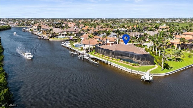 bird's eye view featuring a residential view and a water view