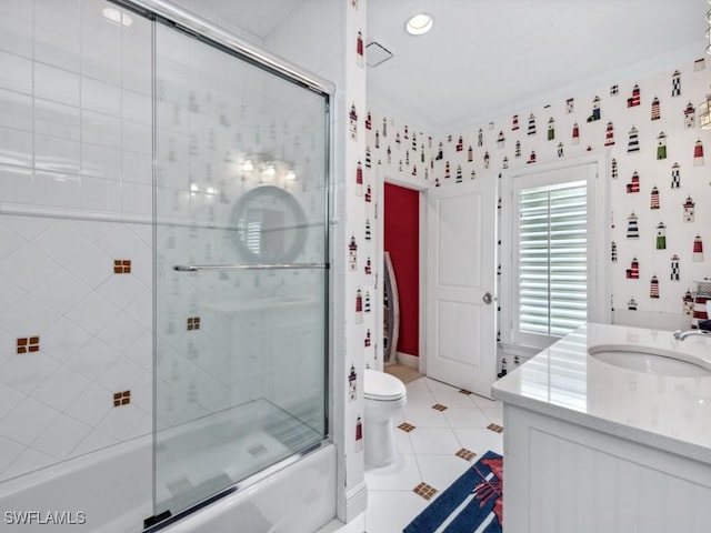 bathroom with bath / shower combo with glass door, vanity, toilet, and tile patterned floors