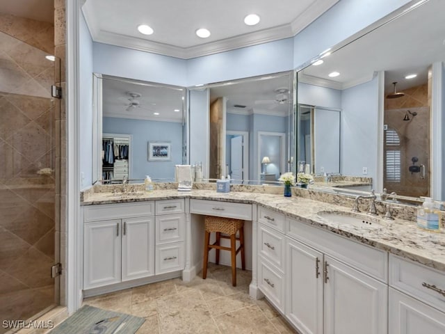 bathroom with a stall shower, ceiling fan, ornamental molding, and vanity