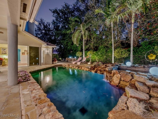 view of pool with a patio, fence, and a fenced in pool