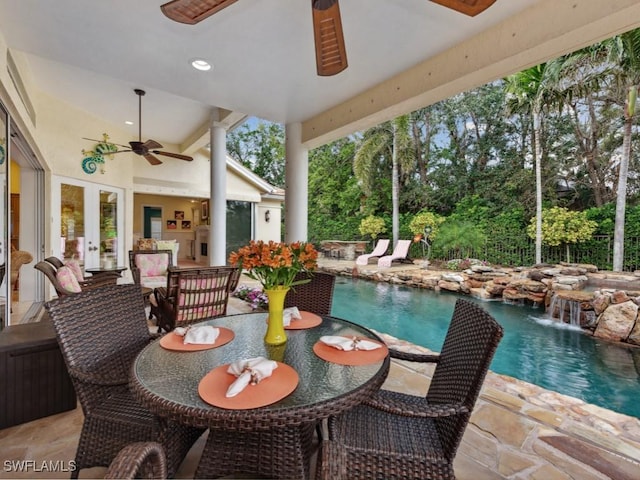 exterior space featuring ceiling fan, french doors, outdoor dining space, and an outdoor pool