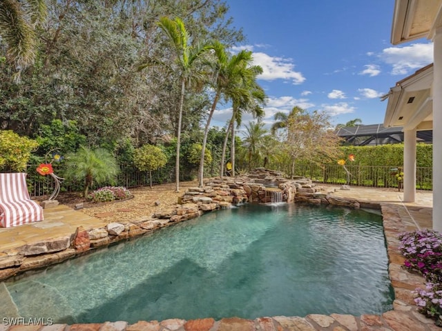 view of swimming pool featuring a patio area and a fenced in pool