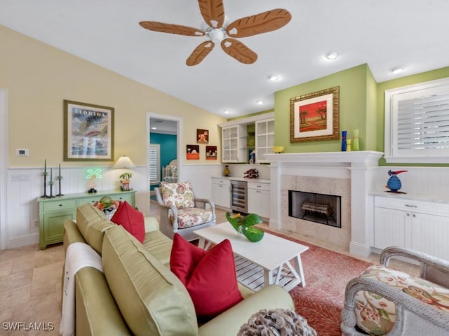 762 Lynnmore Ln E, Naples, FL 34108 - living room with ceiling fan, a fireplace, beverage cooler, recessed lighting, and lofted ceiling