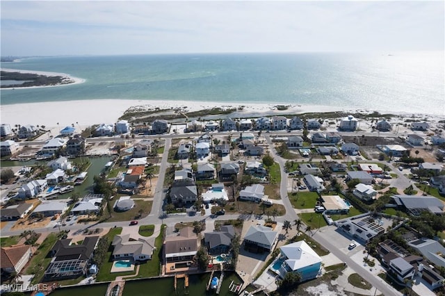 aerial view featuring a water view, a residential view, and a view of the beach