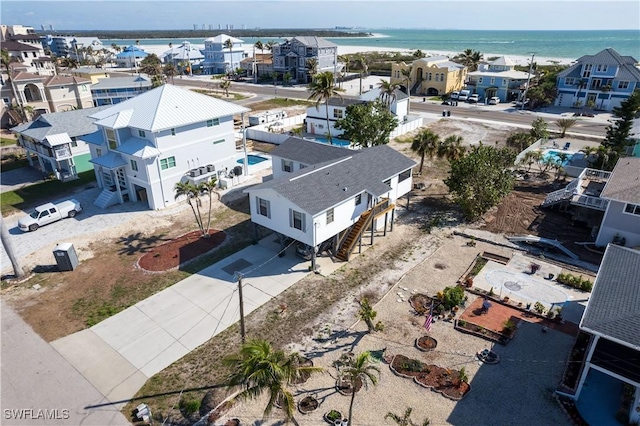 birds eye view of property with a residential view and a water view