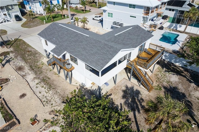 birds eye view of property with a residential view