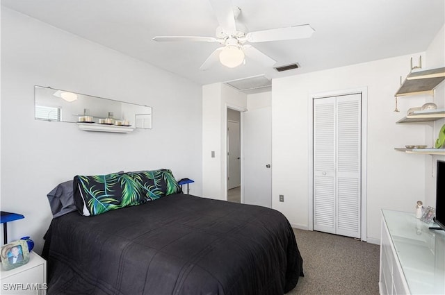 bedroom with a closet, visible vents, attic access, a ceiling fan, and light carpet