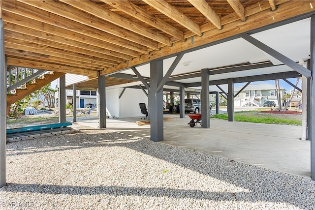 view of parking / parking lot featuring stairs