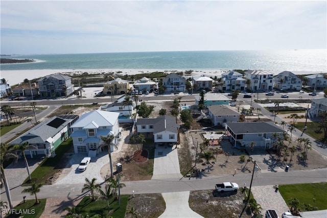 bird's eye view with a residential view and a water view