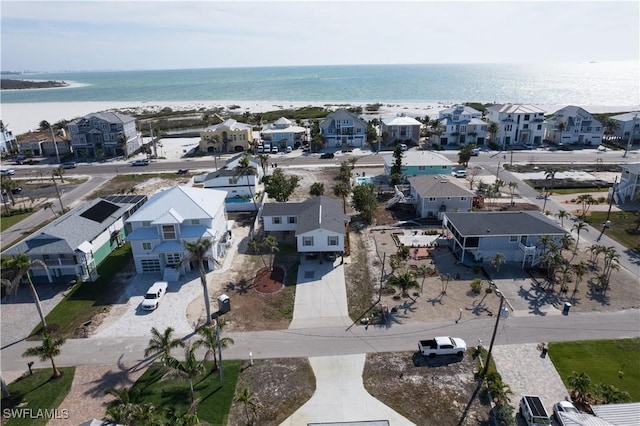 birds eye view of property with a residential view and a water view