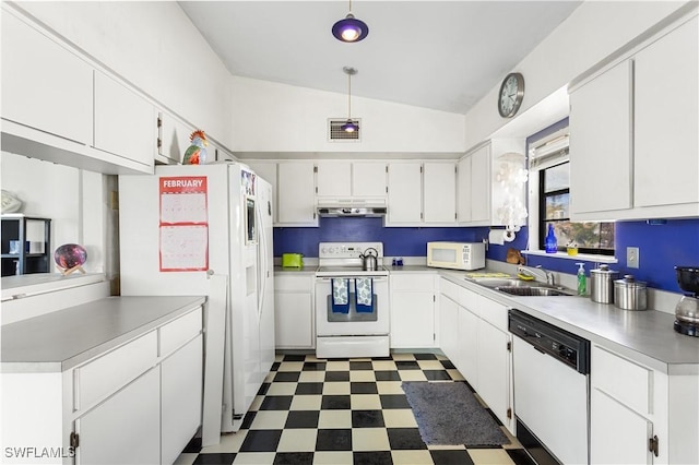 kitchen with dark floors, light countertops, white cabinets, a sink, and white appliances