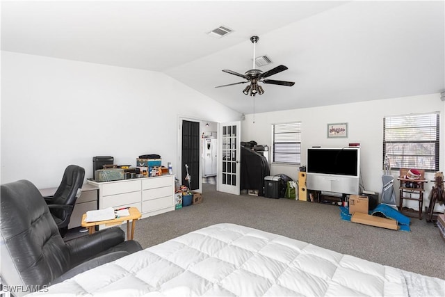 carpeted bedroom featuring lofted ceiling, french doors, visible vents, and a ceiling fan