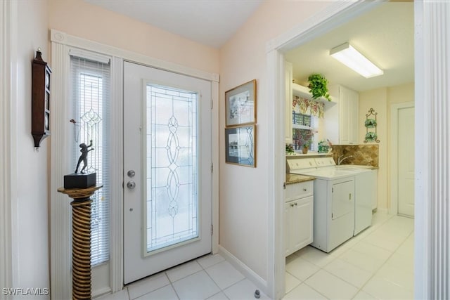 interior space featuring baseboards and separate washer and dryer