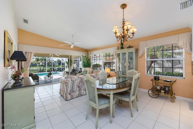 dining area with a sunroom, visible vents, vaulted ceiling, and light tile patterned flooring