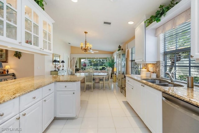 kitchen with a notable chandelier, a sink, visible vents, stainless steel dishwasher, and tasteful backsplash