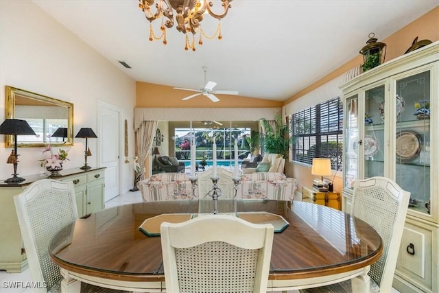 dining area with lofted ceiling, a sunroom, ceiling fan, and visible vents