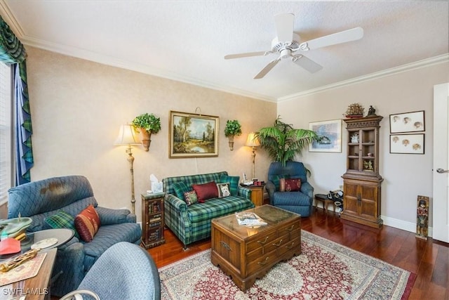 living room with crown molding, baseboards, ceiling fan, and wood finished floors