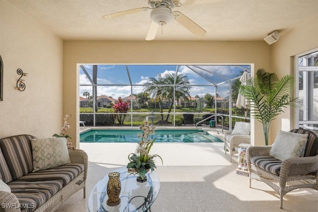 outdoor pool featuring ceiling fan