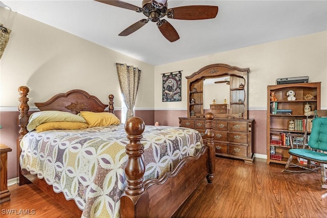 bedroom with ceiling fan and wood finished floors