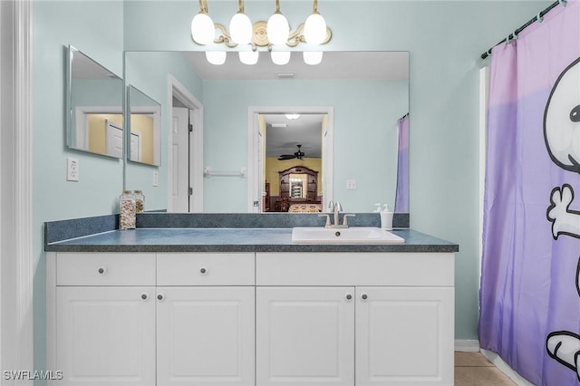 bathroom with visible vents, connected bathroom, vanity, and tile patterned floors